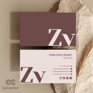 May include: Two rectangular business cards featuring a dark brown and light beige colour scheme. The top card displays the large white letters Zv. The bottom card features the dark brown letters Zv, the name Vincent Hart, Creator, and contact details.