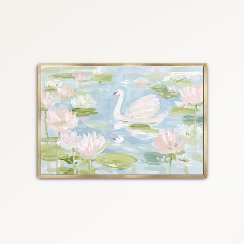 May include: A rectangular wall art print in a gold frame featuring an impressionistic painting of a white swan swimming on a light blue pond surrounded by numerous pale pink water lilies and green lily pads with visible brushstroke textures.