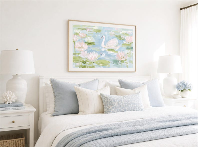 May include: A framed horizontal wall art print featuring a white swan swimming in a pond filled with pink water lilies and green lily pads. The painting uses soft pastel tones of blue, green, and pink to depict a serene aquatic scene.