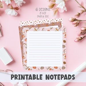 May include: Printable notepads with six designs, each 3x3 inches. The notepads feature fall-themed patterns with pumpkins and coffee drinks. The notepads are on a pink background with floral accents. The text "PRINTABLE NOTEPADS" is displayed at the bottom.