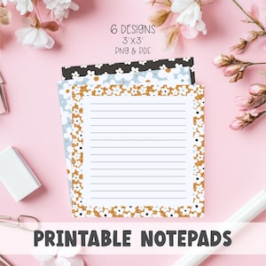 Puede incluir: Blocs de notas imprimibles con diseños florales. Los blocs de notas miden 7,6 x 7,6 cm y vienen en 6 diseños. Los blocs de notas tienen páginas rayadas y están rodeados por un borde floral. El texto "PRINTABLE NOTE PADS" está en la parte inferior de la imagen.