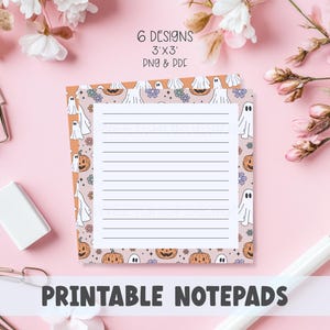 May include: Printable notepads with a Halloween theme. The notepad features a lined interior and a decorative border with ghosts and pumpkins. The text "6 Designs 3'x3' PNG & PDF" is displayed at the top. The words "PRINTABLE NOTE PADS" are at the bottom.