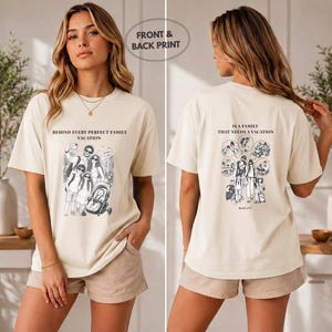 May include: A cream-colored short-sleeve t-shirt featuring black graphic prints on the front and back. The front text reads BEHIND EVERY PERFECT FAMILY VACATION above a family illustration. The back text reads IS A FAMILY THAT NEEDS A VACATION.
