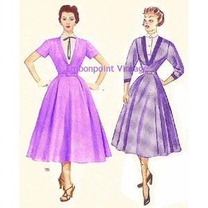May include: Two vintage dress patterns with illustrations of women wearing the dresses. The dress on the left is a solid purple, while the dress on the right is a purple and white gingham pattern. Both dresses have a V-neckline and a fitted bodice.