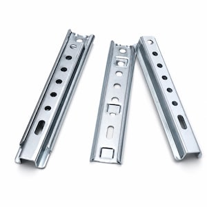 May include: Three silver-colored metal drawer slides with a U-shaped profile. Each piece features a series of circular and rectangular punched holes along the center and side flanges, designed for mounting and adjustment purposes.
