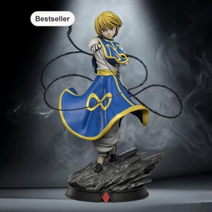 May include: A figurine of a character with blonde hair, wearing a blue and gold outfit, and holding a black whip. The figurine is standing on a rocky base with a black and red trim. The word "Bestseller" is in a white oval in the top left corner.