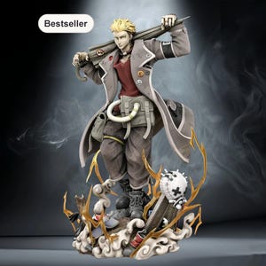 May include: A detailed anime-style figurine of a blonde character wearing a long grey coat over a maroon shirt and dark trousers. The character holds a long object over their shoulder, standing on a base with sculpted smoke and a white sphere.