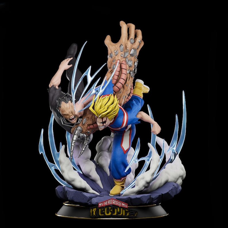 Puede incluir: Figura de acci&oacute;n din&aacute;mica que representa una escena de lucha entre dos personajes. Uno lleva un traje azul y rojo con pelo rubio puntiagudo, el otro un atuendo oscuro. La base tiene el texto "MY HERO ACADEMIA" en japon&eacute;s.