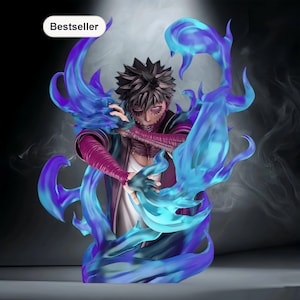 May include: A detailed figurine of a character with dark spiky hair, purple and red clothing, and blue flames. The figure has stitched facial features and is surrounded by stylized blue flames. The word "Bestseller" is in a white oval.