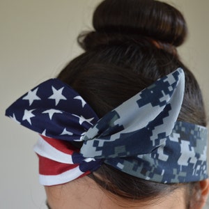 May include: A blue and white headband with a camouflage pattern. The headband is tied in a knot on top of the head.