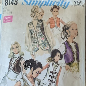 May include: Simplicity sewing pattern 8143 featuring vintage fashion designs. The illustrations showcase various vests and jackets with ornate details, including fur trim and embroidered patterns. The pattern includes sizing information for Misses.