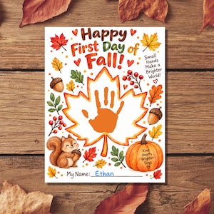May include: A white craft sheet titled Happy First Day of Fall with a large orange handprint inside a maple leaf outline. It features illustrations of a squirrel, acorns, berries, and a pumpkin with the text Small Hands Make a Brighter World and Kind Hearts Brighter Days. The name Ethan is written on the line.