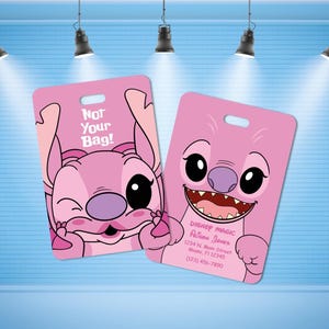 May include: Two rectangular pink luggage tags featuring a cartoon character with large eyes and a purple nose. One tag displays the text "Not Your Bag!" and the other shows "Disney Magic," a name, an address in Miami, FL, and a phone number.