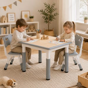 May include: A square activity table with a light wood-grain top and adjustable white and grey legs, accompanied by two matching grey and white chairs. The table features a smooth surface, and the chairs have a cutout design on the backrests.