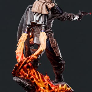 A detailed statue of a character with a backpack, holding a gun and surrounded by flames.