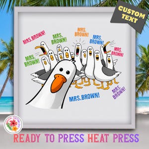 May include: A white and grey seagull graphic print featuring a large foreground seagull and a flock of smaller seagulls behind it. The text "MRS. BROWN!" is repeated in various colours including pink, green, orange, blue, and purple around the birds.