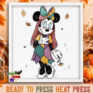 May include: A framed digital illustration of a cartoon mouse character with long pink hair, wearing a patchwork dress and a matching bow. The character has stitched facial details, holds a small flower, and is surrounded by falling leaves and spiders.