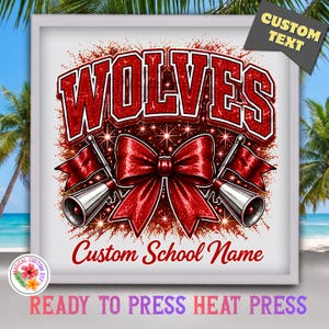 May include: A graphic design featuring the word WOLVES in large red glittery letters above a red glittery bow flanked by two silver megaphones with red flags. Below the bow, the text reads Custom School Name in red script.