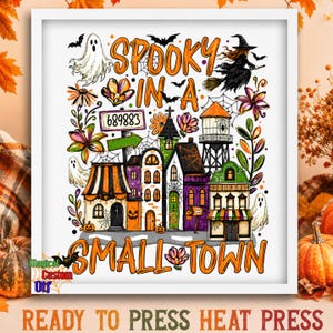 May include: A white framed graphic print featuring a small town scene with ghosts, a witch on a broom, bats, and colorful flowers. The text reads SPOOKY IN A SMALL TOWN and includes a sign with the number 689883. The design has a Halloween theme.