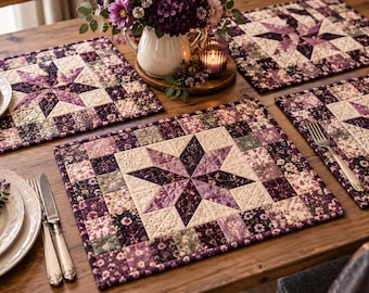 May include: Rectangular quilted placemats featuring a central eight-pointed star pattern in shades of purple, cream, and dark floral prints. The fabric is stitched with a grid-like texture, creating a layered, patchwork appearance.
