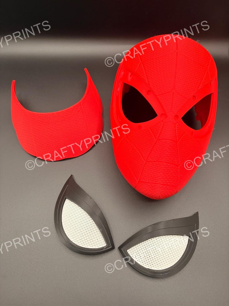 May include: A bright red 3D printed mask with a textured web pattern, a separate red curved forehead piece, and two black eye lenses with white mesh inserts. The text CRAFTYPRINTS is visible multiple times across the image components.