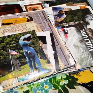 May include: A collage of various printed paper clippings and photographs featuring a blue dinosaur statue with an American flag, a person kayaking in white water with the text CULTURE, and other travel-themed imagery layered together.
