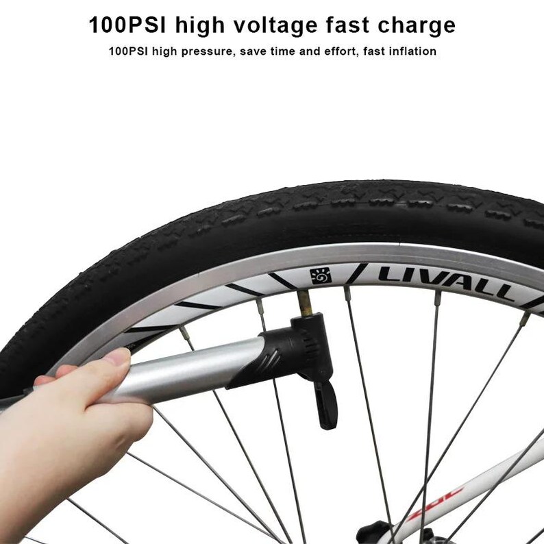 May include: A silver and black bicycle pump attached to a black tire on a silver rim with the text LIVALL. The text 100PSI high voltage fast charge and 100PSI high pressure, save time and effort, fast inflation is printed above the wheel.