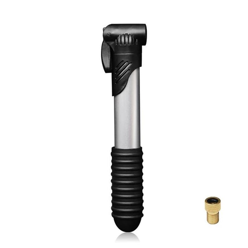May include: A portable bicycle pump featuring a silver metallic barrel, a black plastic handle with a textured grip, and a black nozzle head. Beside the pump is a small, cylindrical brass-colored valve adapter with a threaded exterior surface.