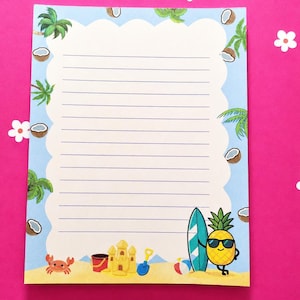 May include: A rectangular sheet of lined stationery featuring a scalloped white centre bordered by a light blue frame with illustrations of palm trees and coconuts. The bottom shows a sandy beach with a crab, sandcastle, bucket, and pineapple.