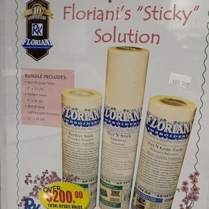 May include: A bundle of three rolls of Floriani embroidery stabiliser products labelled Perfect Stick, Wet N Stick, and Wet N Gone Tacky. The packaging includes a list of contents, the text Floriani's Sticky Solution, and floral border graphics.