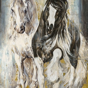 May include: A painting featuring two horses, one white and one black and white, with flowing manes. The background is a textured mix of gold, white, and blue tones with faint cursive French script visible on the surface of the artwork.