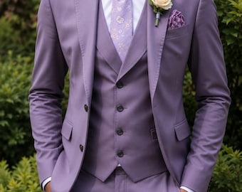 May include: A lavender three-piece suit featuring a single-breasted jacket, a matching vest with four buttons, and trousers. The ensemble includes a white dress shirt, a patterned lavender tie, and a cream-colored boutonniere on the lapel.