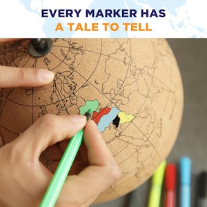May include: A cork globe featuring a world map with black outlines. The text EVERY MARKER HAS A TALE TO TELL is printed at the top. A green marker is used to color in a section of the map, while other sections are filled in with red, blue, black, and yellow.