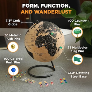 May include: A 7.3-inch cork globe with a black map print on a 360-degree rotating steel base. The set includes 50 metallic push pins, 100 colored push pins, and 25 multicolor flag pins. Text reads: Form, Function, and Wanderlust.