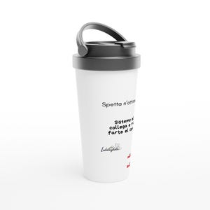 May include: White travel mug with a black lid and handle. The mug features text in Italian. The mug is cylindrical and has a black lid with a flip-top opening. The handle is also black.