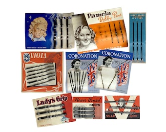 Collection of vintage hair clips, bobby pins on their original packaging display cards. Mostly made in English and German. 1940s-60s.