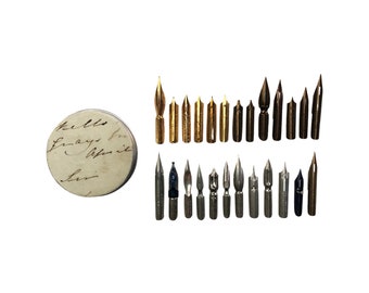 Gift tin with 25 different vintage unused dip pen nibs.