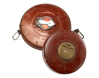 A choice of cased Chesterman cloth tape measures, 66 feet or 33 feet.