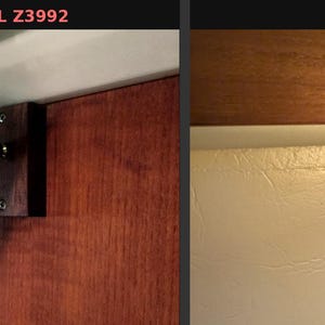 May include: A cream-coloured, cylindrical wall-mounted light fitting with a dark brown button and a wooden mounting bracket. The fitting is angled downwards, and the text "ORIGINAL Z3992" is visible in the top left corner.