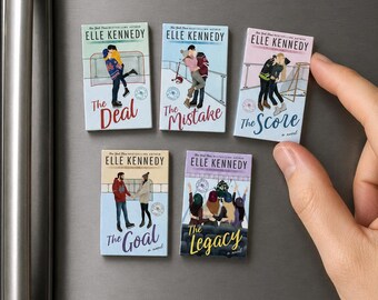May include: Five rectangular magnets featuring book covers by Elle Kennedy. Titles include "The Deal," "The Mistake," "The Score," "The Goal," and "The Legacy." Each magnet displays colorful illustrations of people and scenes, with the author's name prominently displayed.