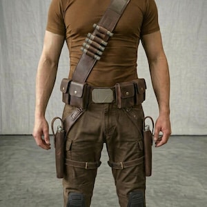 May include: A brown t-shirt paired with a brown leather utility belt and bandolier set. The gear includes multiple pouches, a metallic buckle, two side holsters, and knee pads integrated into the brown trousers for a functional, tactical appearance.