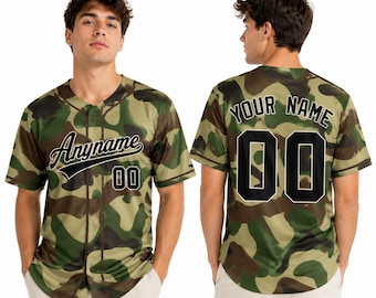 May include: A short-sleeved baseball jersey featuring a green, brown, and tan camouflage pattern. The front displays the text Anyname and the number 00 in black. The back shows the text YOUR NAME and the number 00 in large black lettering.