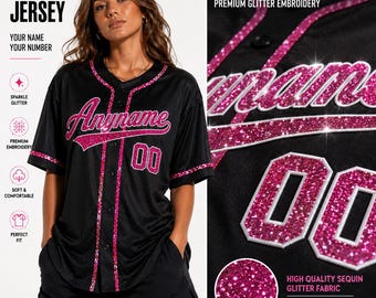 May include: A black baseball jersey featuring pink glitter embroidery for the text Anyname and the number 00. The jersey has a button-down front with pink glitter trim along the placket, collar, and sleeve cuffs, showcasing a textured finish.