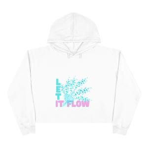 May include: A white cropped hoodie featuring a graphic design on the center chest. The design includes the text LET IT FLOW in light blue and pink, accompanied by a cluster of small light blue butterflies emerging from a textured cone shape.