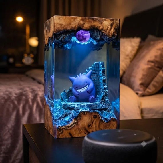 A graveyard moonscape with Gengar rising from burl wood, cast in purple epoxy resin — handmade art-lamp crossover that's equal parts Pokémon tribute and gallery piece.