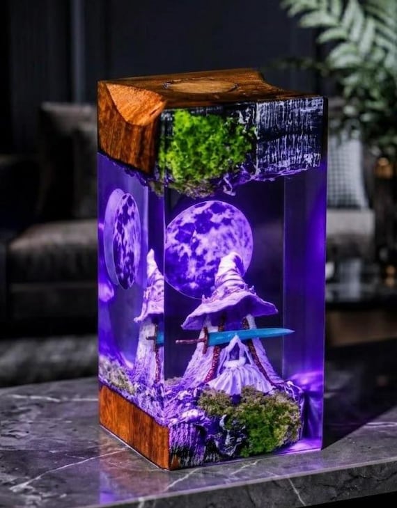 A handmade epoxy resin tower lamp capturing Ranni the Witch from Elden Ring — a glowing, one-of-a-kind piece of fan art you can actually light your room with.