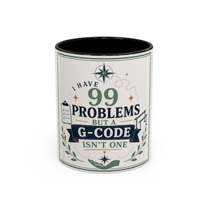 May include: A white ceramic mug with a black interior and rim, featuring a graphic design with the text I HAVE 99 PROBLEMS BUT A G-CODE ISN'T ONE. The design includes a compass rose, a checklist icon, a gymnastics bar, and a hand icon in blue and green.