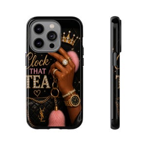 May include: Black phone case featuring a hand adorned with rings and a gold watch, holding a pink pom-pom. The case has the text "Clock That Tea" and a gold crown design. A black purse with a gold chain is also visible.