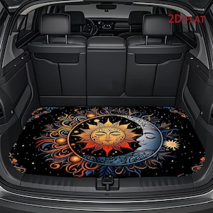 May include: A black car trunk mat featuring a vibrant, circular graphic of a golden sun and a silver crescent moon with closed eyes, surrounded by intricate orange, red, and blue swirling patterns against a starry night sky background.