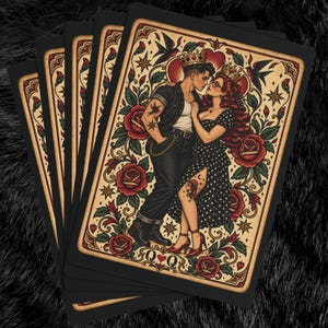 May include: A deck of playing cards featuring a Queen of Hearts design with a romantic illustration of two figures wearing crowns, surrounded by red roses, green leaves, and swallows. The card displays the letters Q and Q with a small red heart symbol.